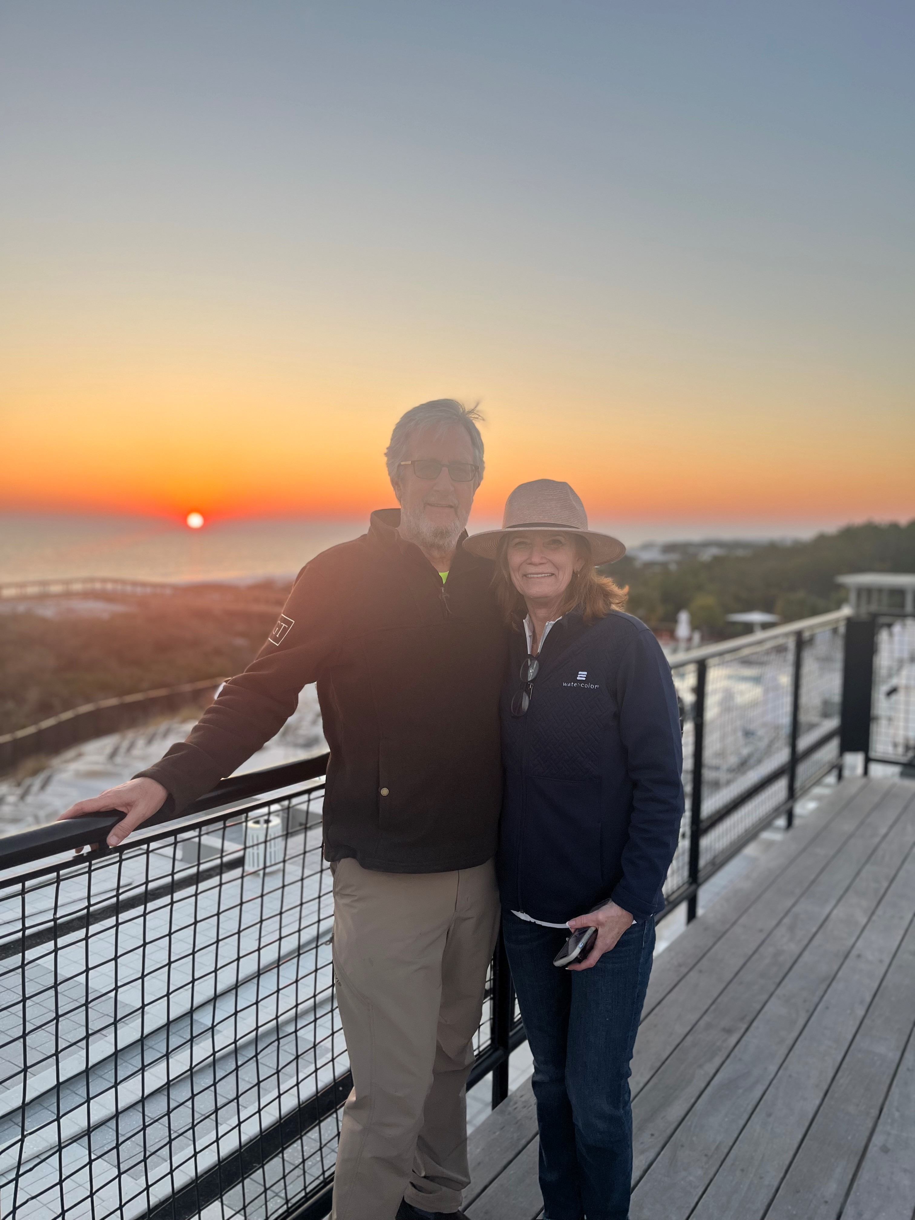 Chuck and his wife celebrate a sunset together