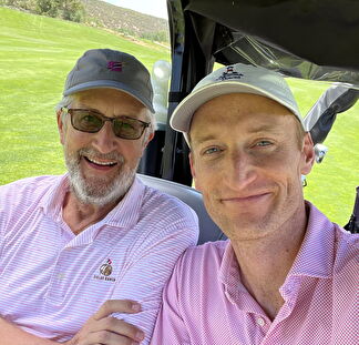 Chuck and Nick, a father-son duo, enjoy an afternoon on the golf course